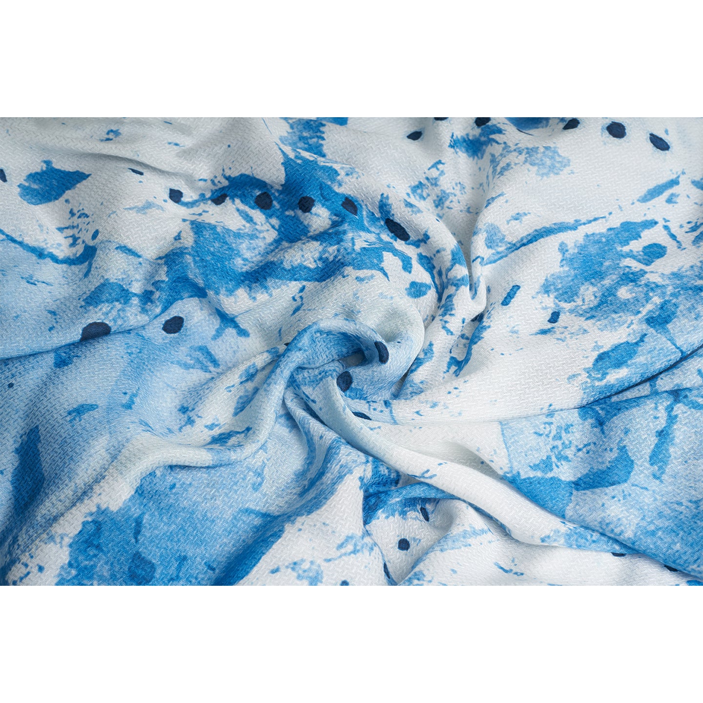 A square blue and white scarf made from organic aloe vera fabric printed with non toxic GOTS certified inks. The print on the scarf is an inspiration from leafs and buds, hand painted with our interpretation.