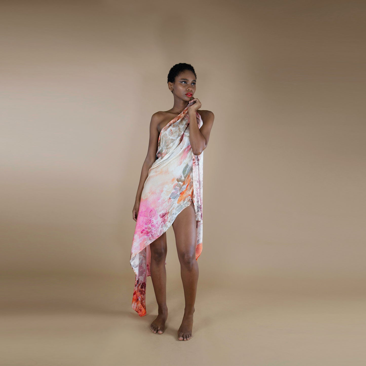 A rectangle scarf made from organic rose petal fabric, printed with non toxic inks. the print is inspired from botanical